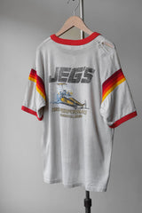 1980年代のヴィンテージ JEG'S ハイパフォーマンス リンガー Tシャツ ヴィンテージ レーシング プリント パイピング ショート キックス