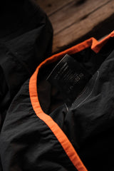 アメリカ・ロサンゼルス発の高性能スポーツブランド、District Vision Vassa Access Shellの機能的な防水ハーフジップポケットシャツです。