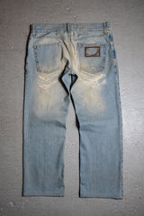 Dolce & Gabbana Distressed Denim Jeans Distressed low-rise jeans made in Italy