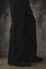 troubled waters CROSS FRINGE PANTS