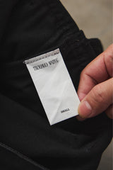 troubled waters CROSS FRINGE PANTS