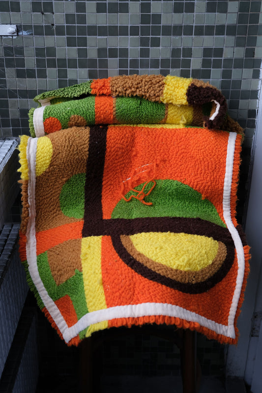 Retro geometric hand-tufted rug (product at Anemone Studio)